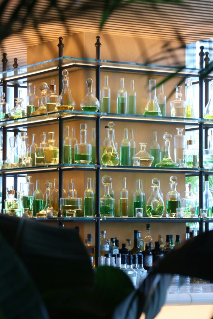 Image of scientists in a lab experimenting with aroma chemicals and plant-based ingredients